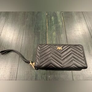 Anne Klein Quilted AK Zip Around Wallet in black with gold-tone hardware